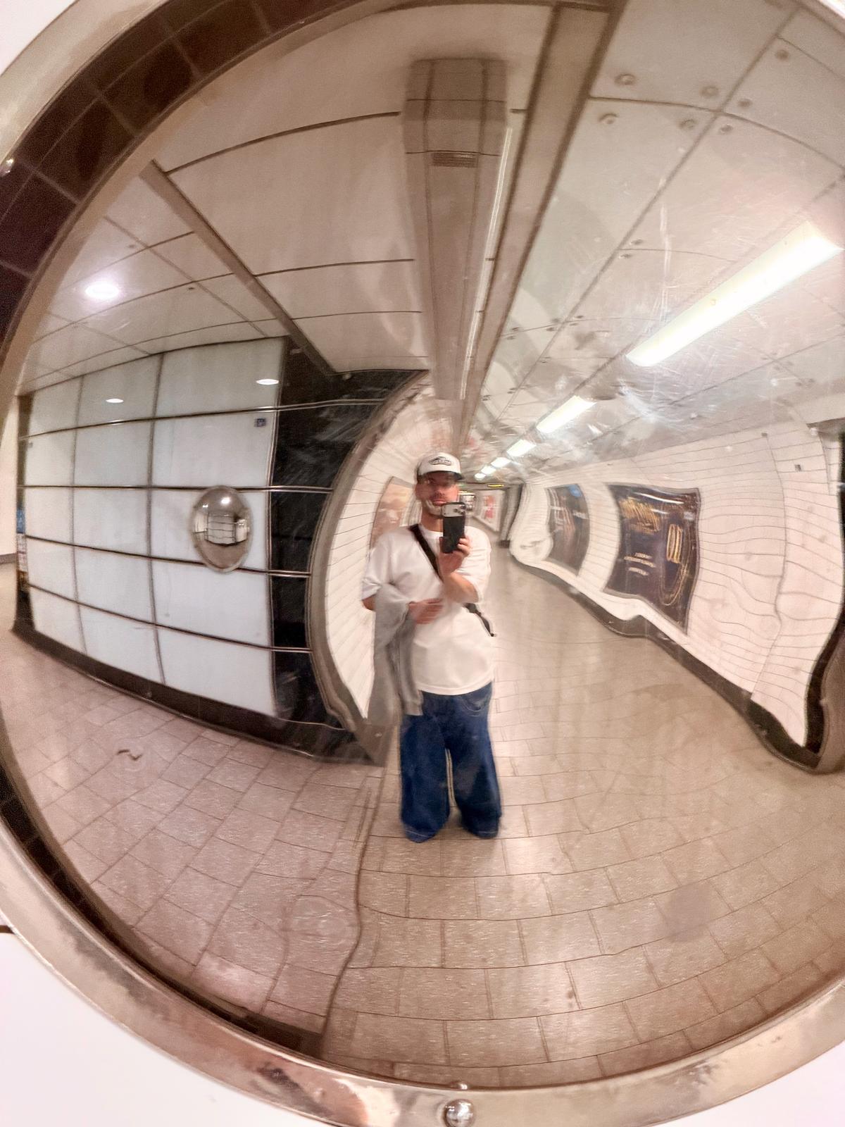 Me in a convex mirror in a tube station