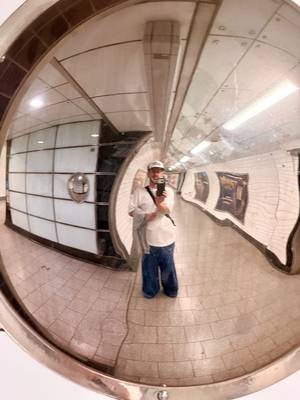 Me in a convex mirror in a tube station