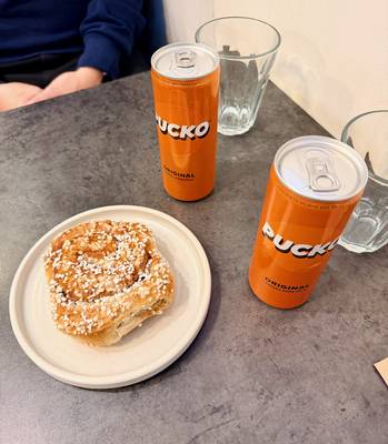 A cinamon bun and Pucko chocolate milk