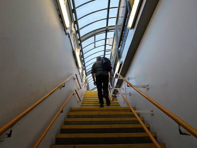 Walking up the stairs at Shadwell DLR station