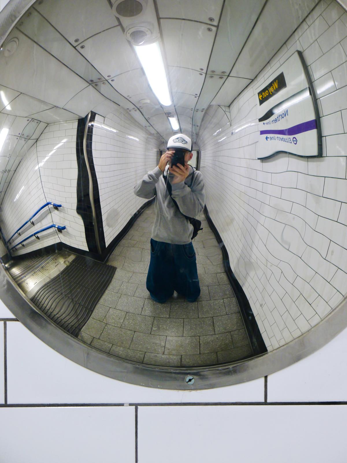 Mirror selfie in Tottenham Hourt Road tube station