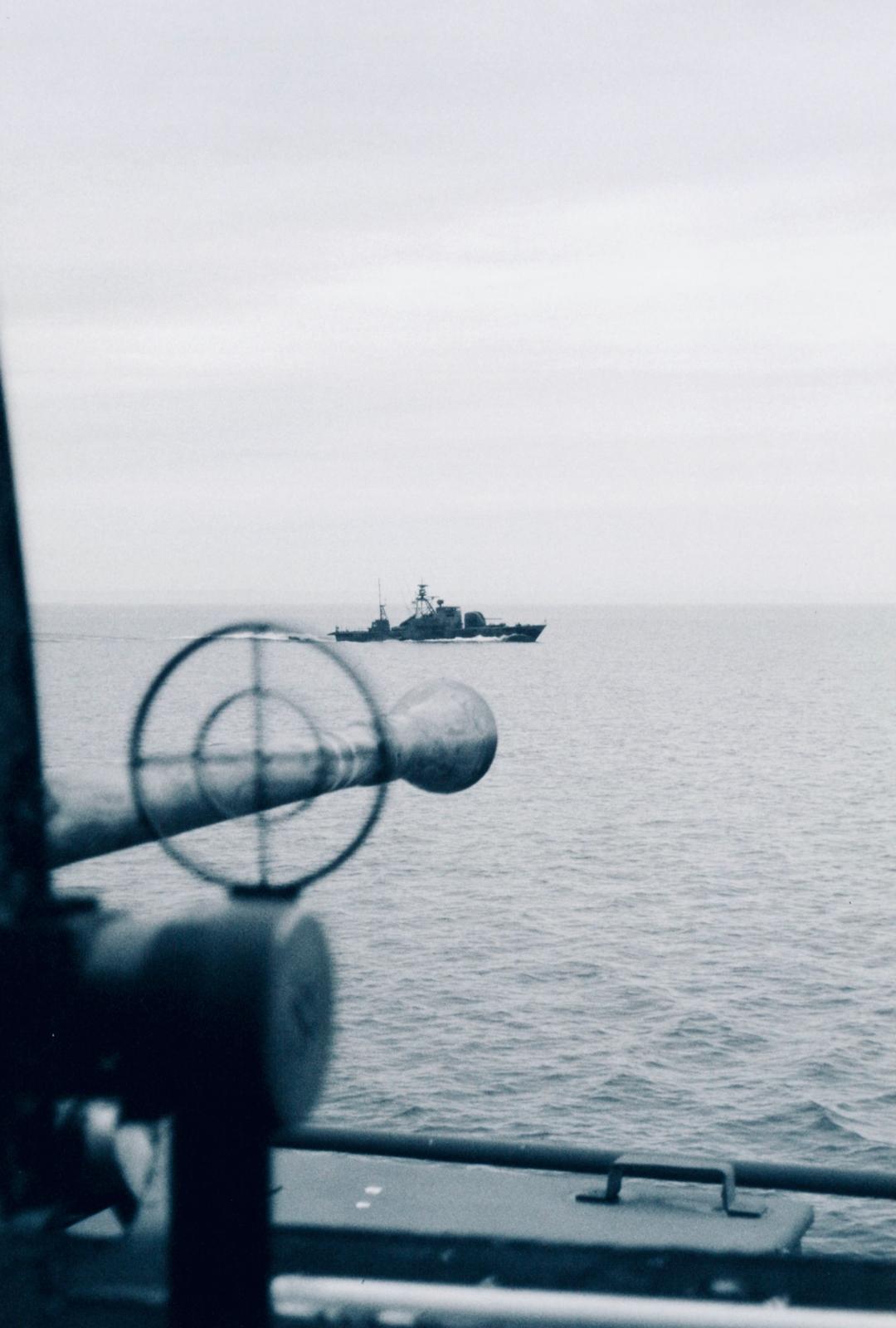 Patrol boat seen from artillery gun