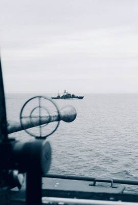 Patrol boat seen from artillery gun